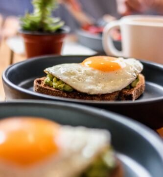 a plate of food with an egg on top of it